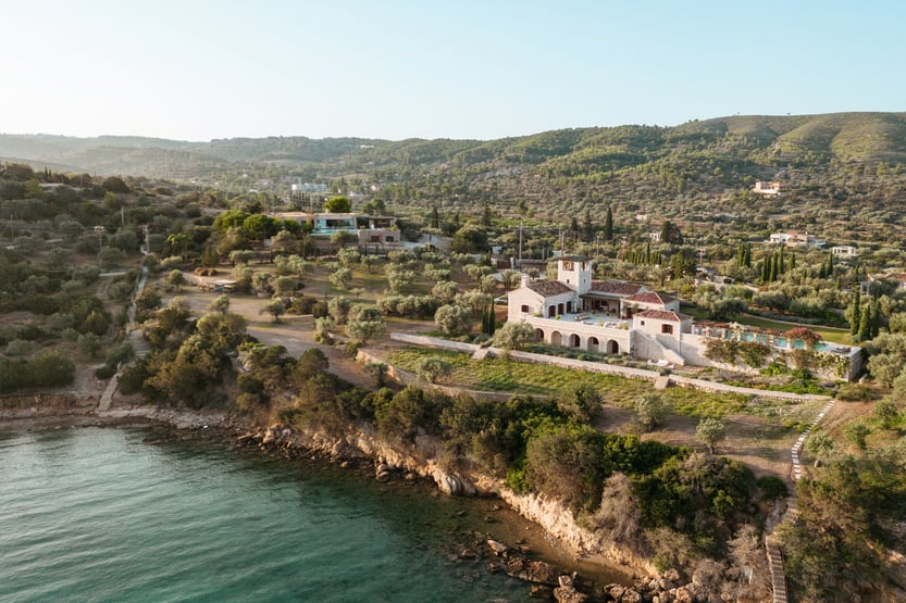 aerial view of villa dwell and its surroundings including the sea