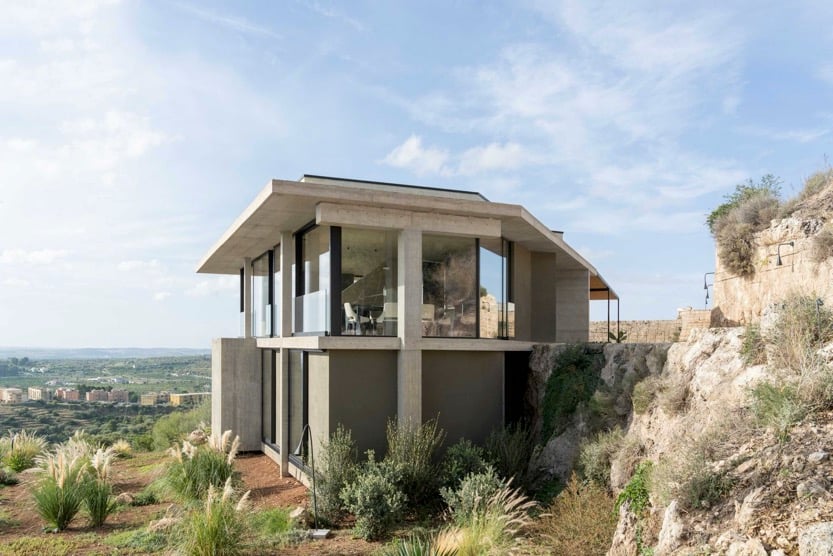 exterior of casa di cemento perched high in the sicilian countryside