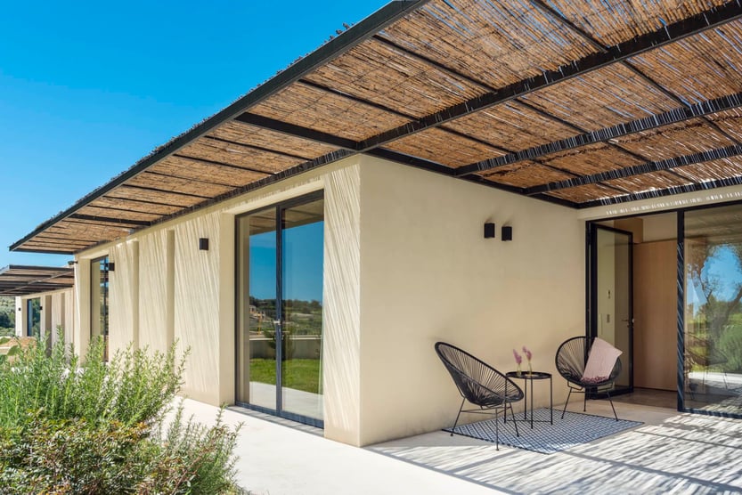 terrace at villa avolesi with black circular chairs in the shade