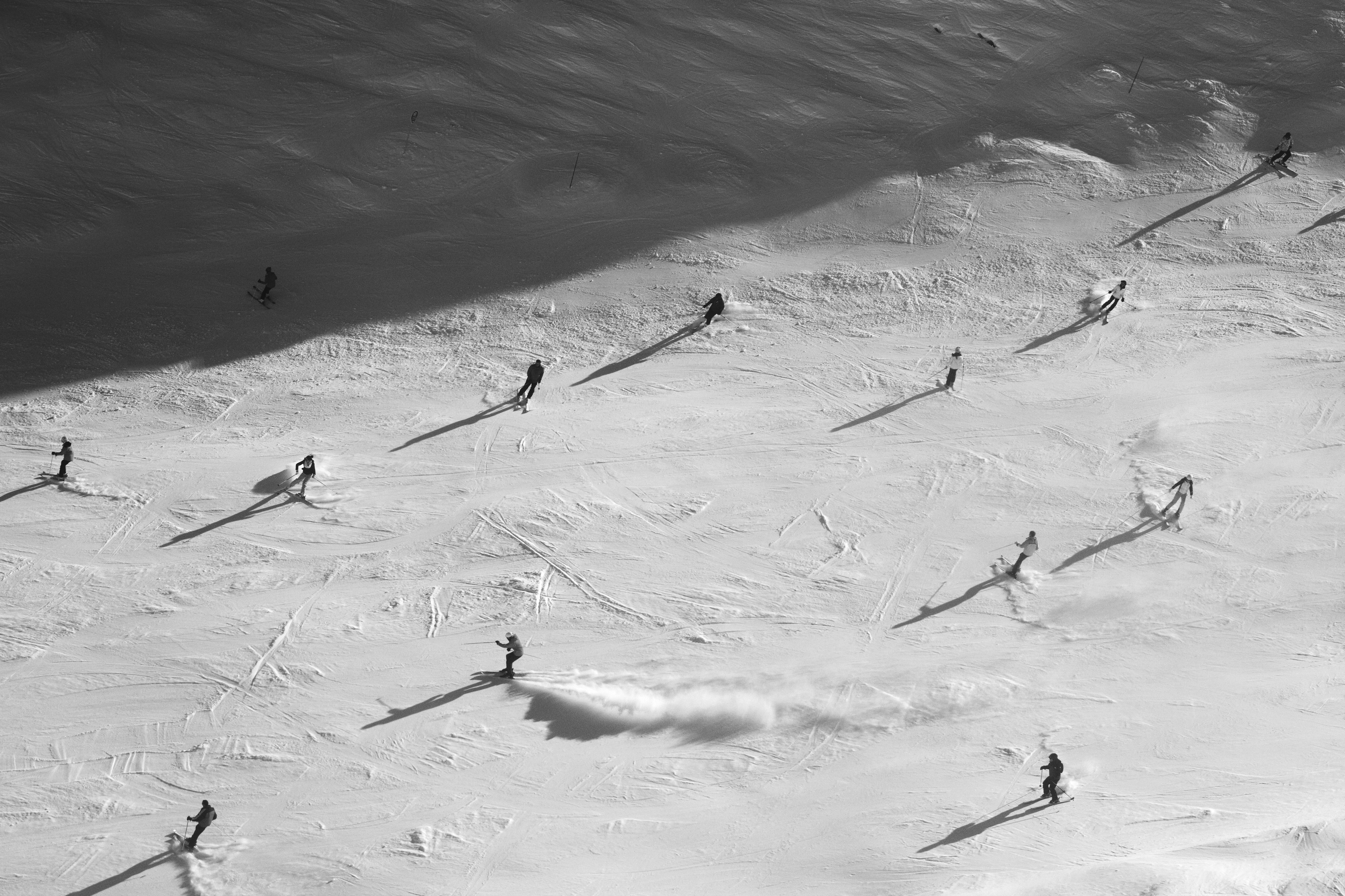 People skiing in different directions