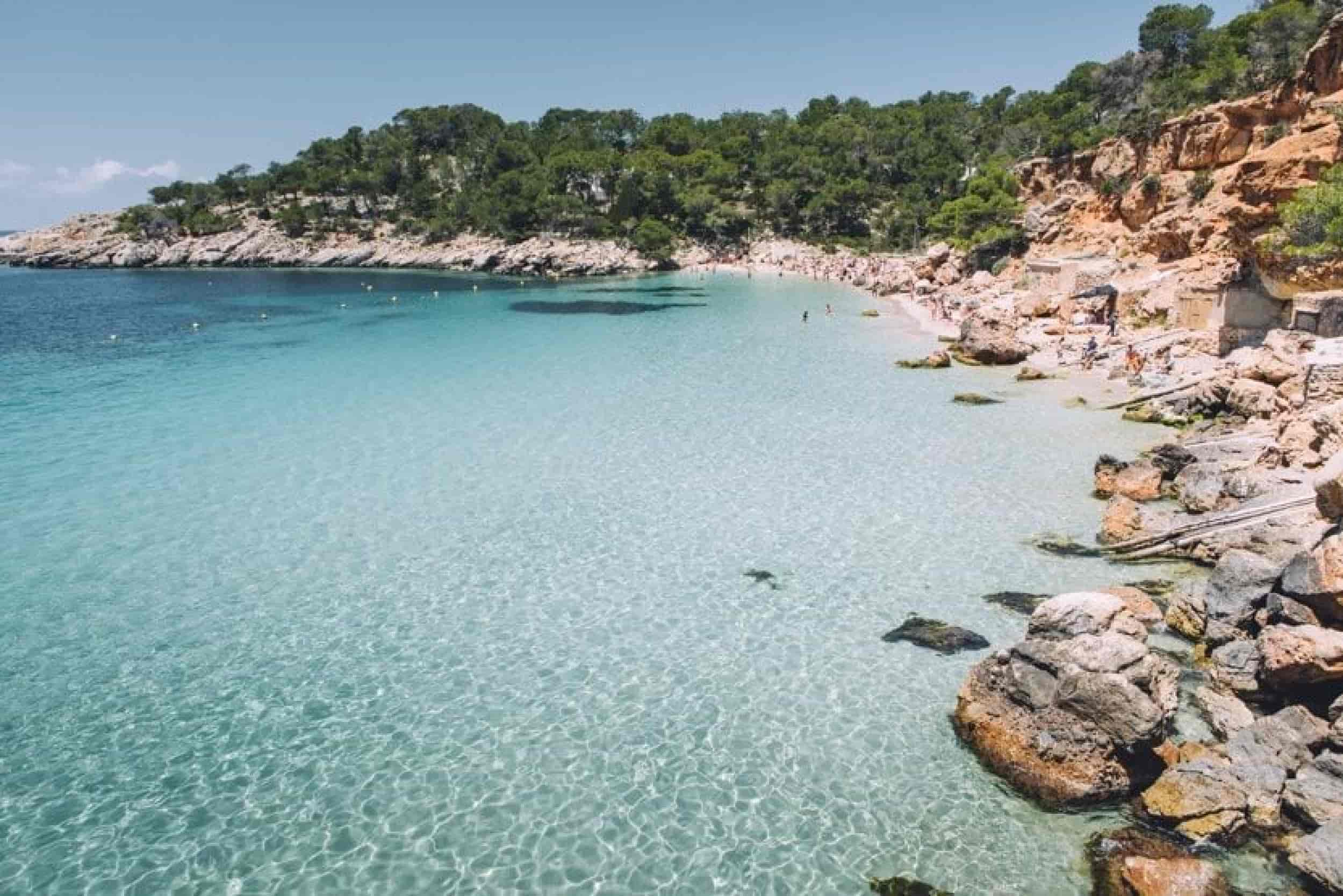 What-to-do-in-Ibiza-in-August-beach-with-clear-water