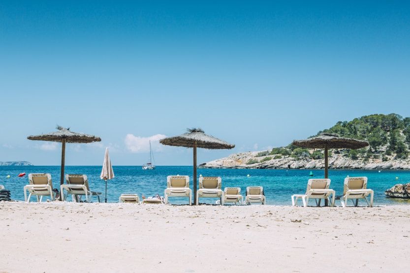 best-part-of-ibiza-for-families-beach-umbrellas