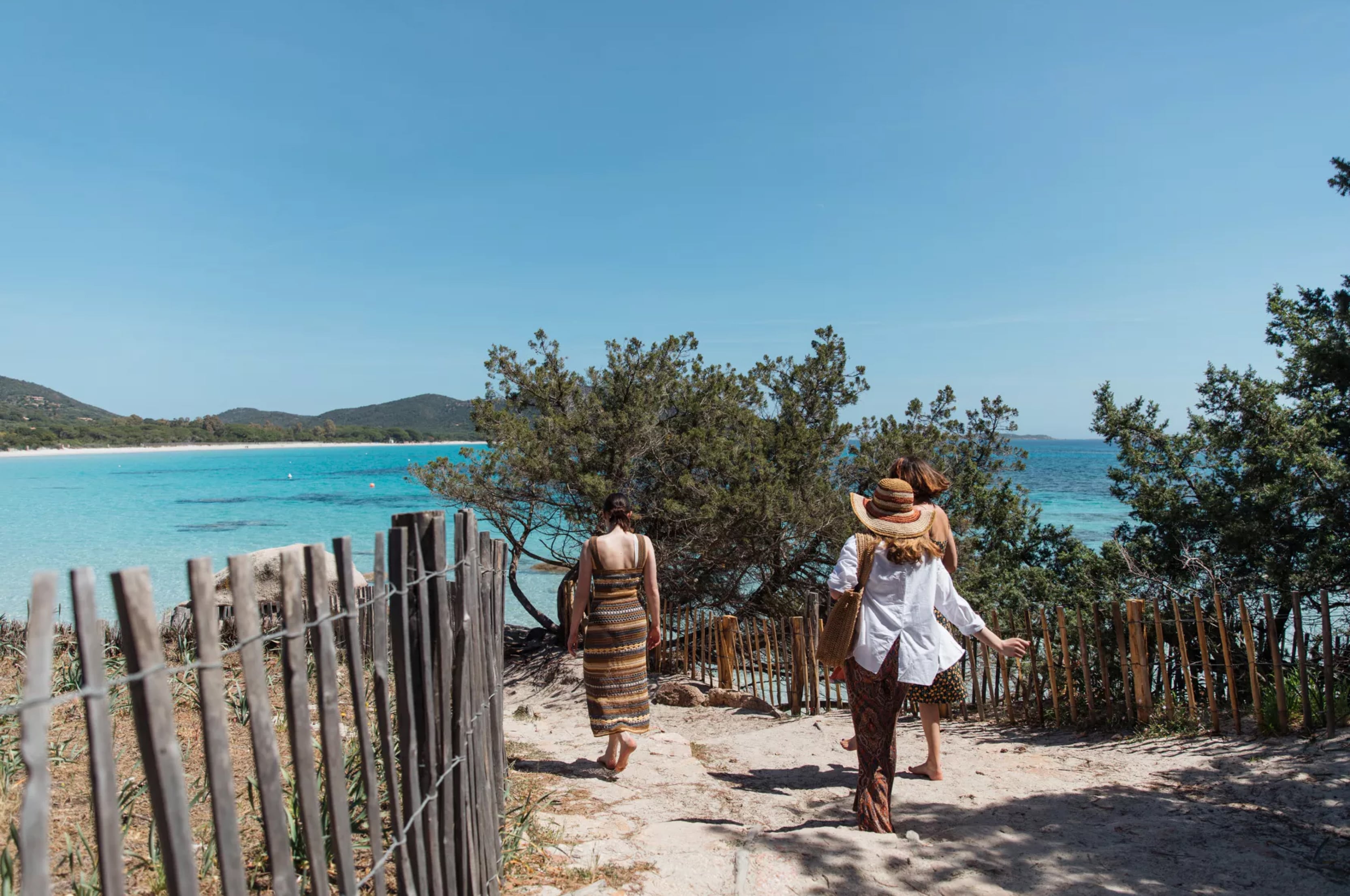 group of friends walking to the beach