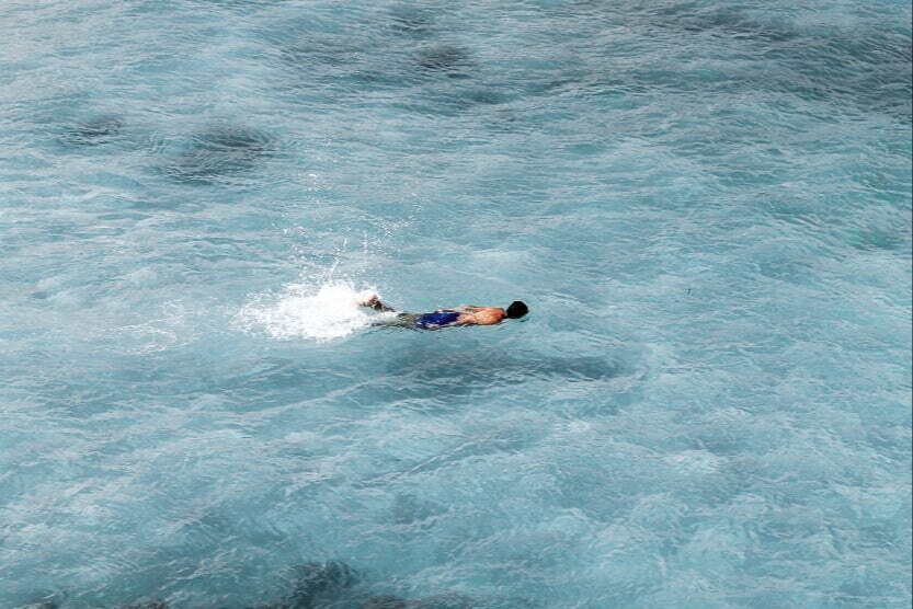 ibiza-in-july-complete-guide-snorkelling-man-tube-splash-sea