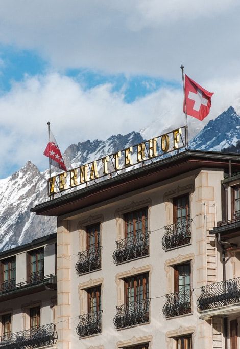 last-minute-luxury-ski-holidays-building-flags
