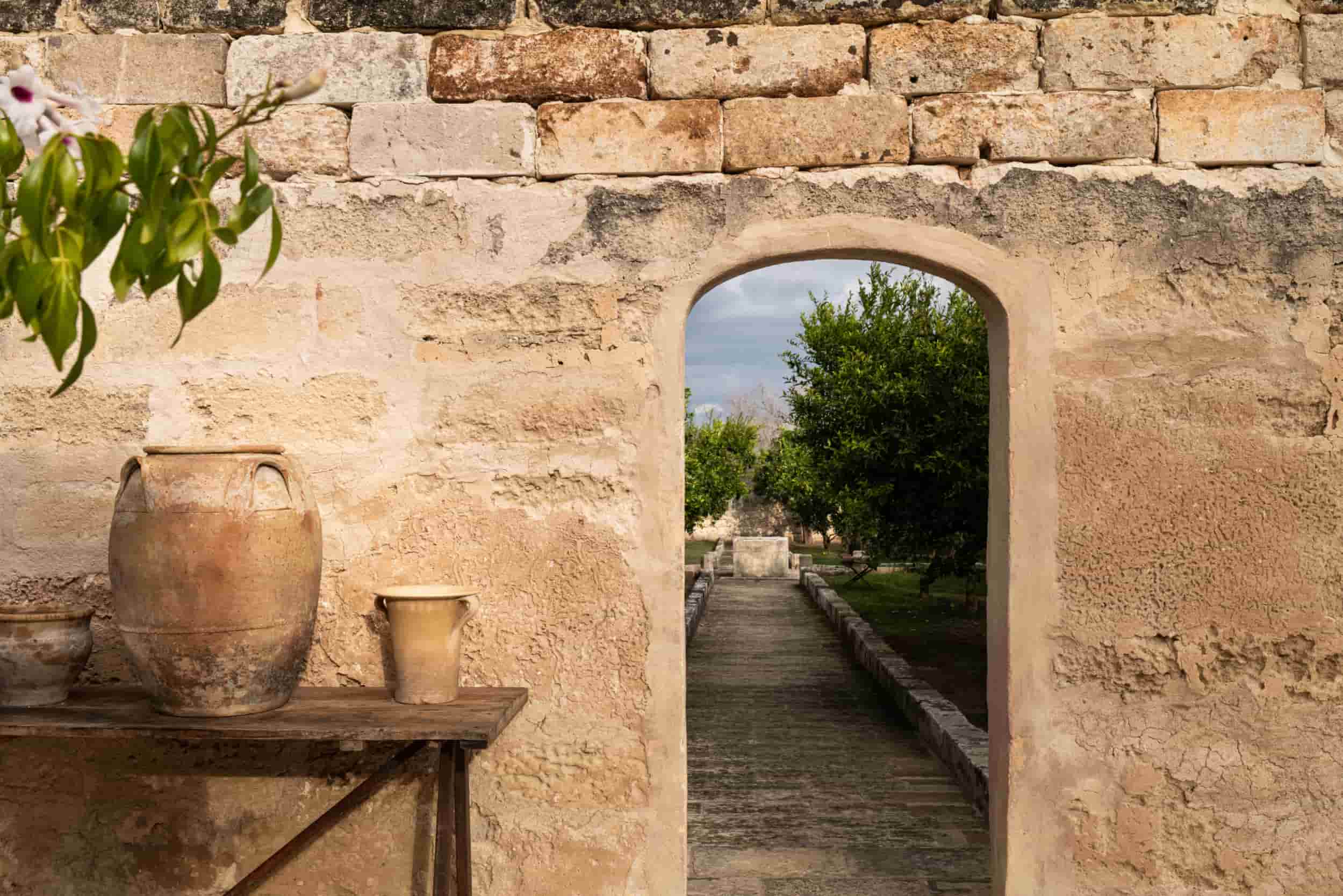 stone entrance to a luxury villa in Italy in summer