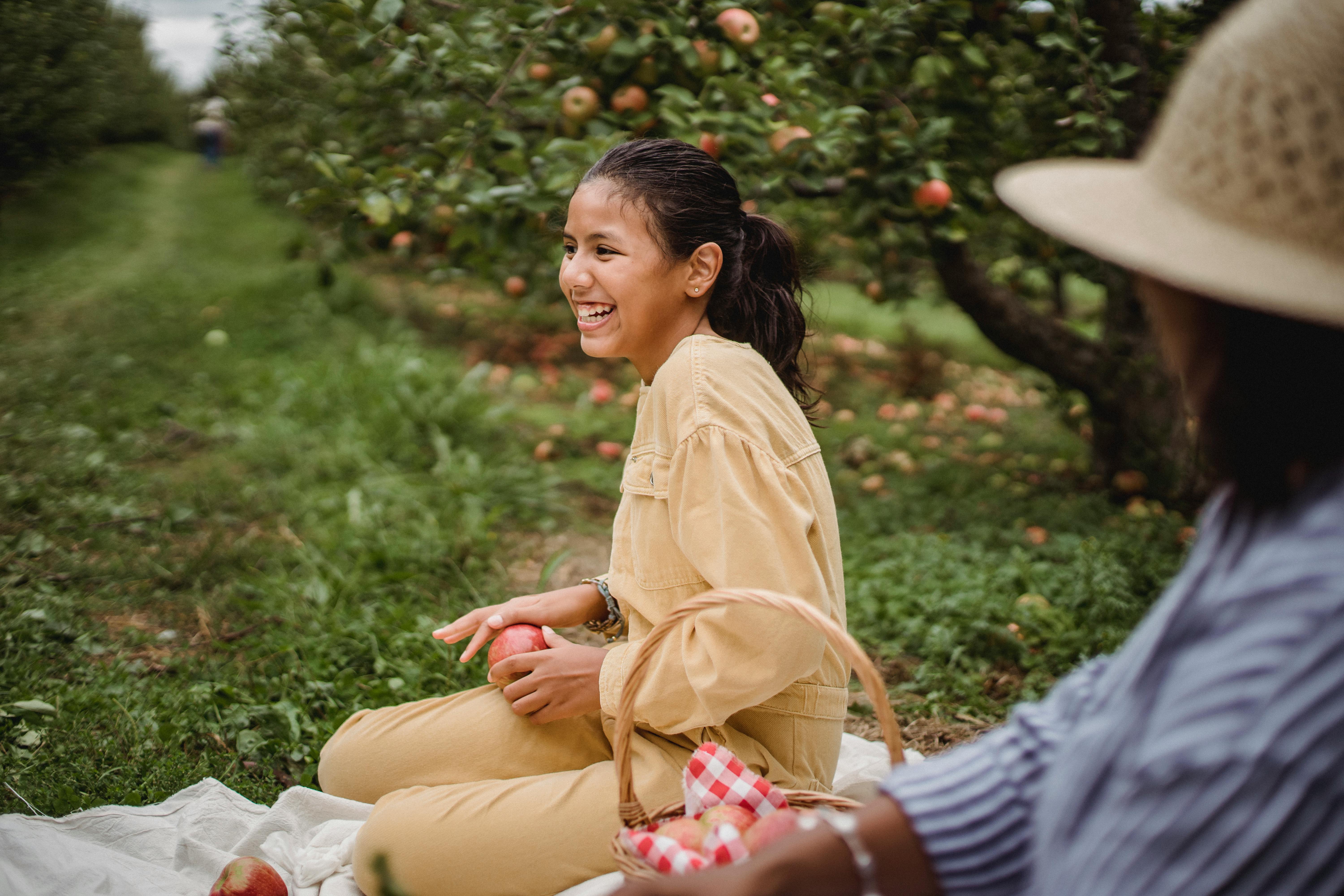 mom and daughter picking apples