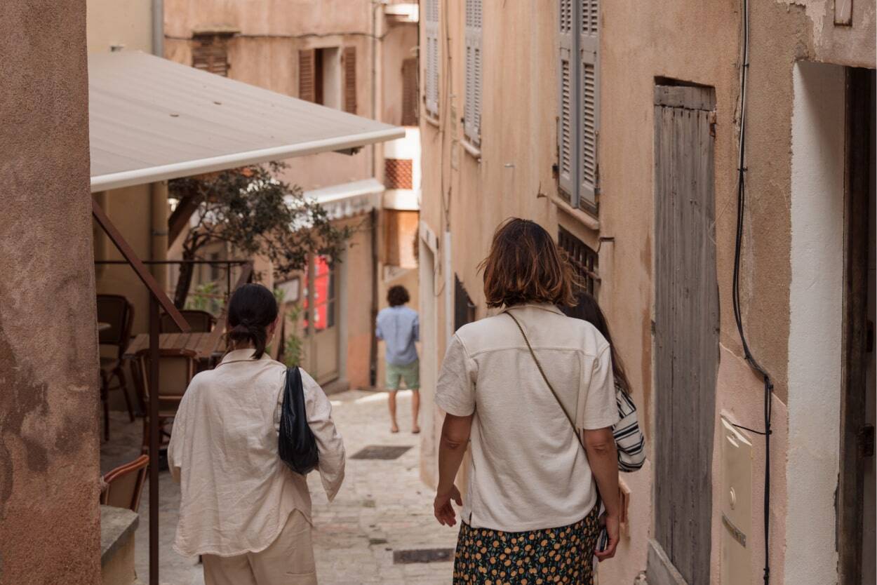 people walking in a village in Ibiza