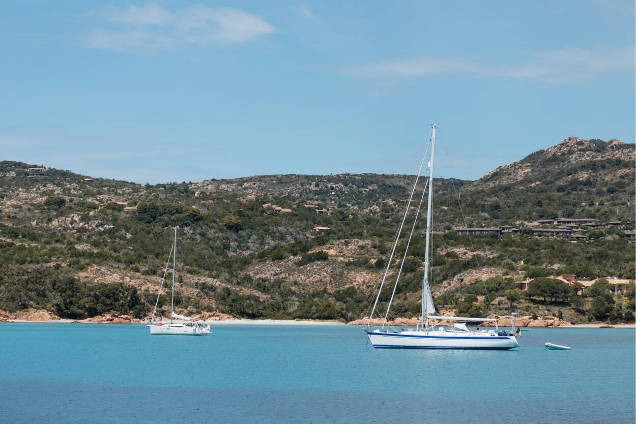 boat in the sea with mountainous view in corsica 