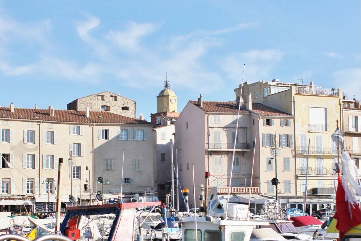 port at port grimaud in saint tropez with boats and colourful houses