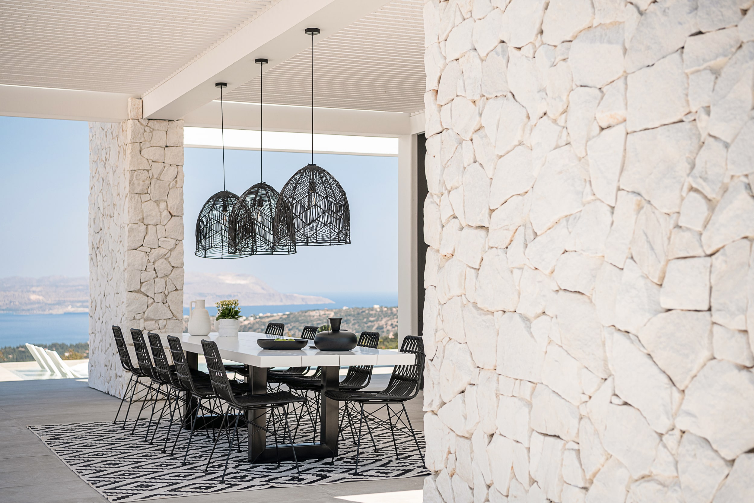 villa-medusa-outdoor-table-stone-wall-min
