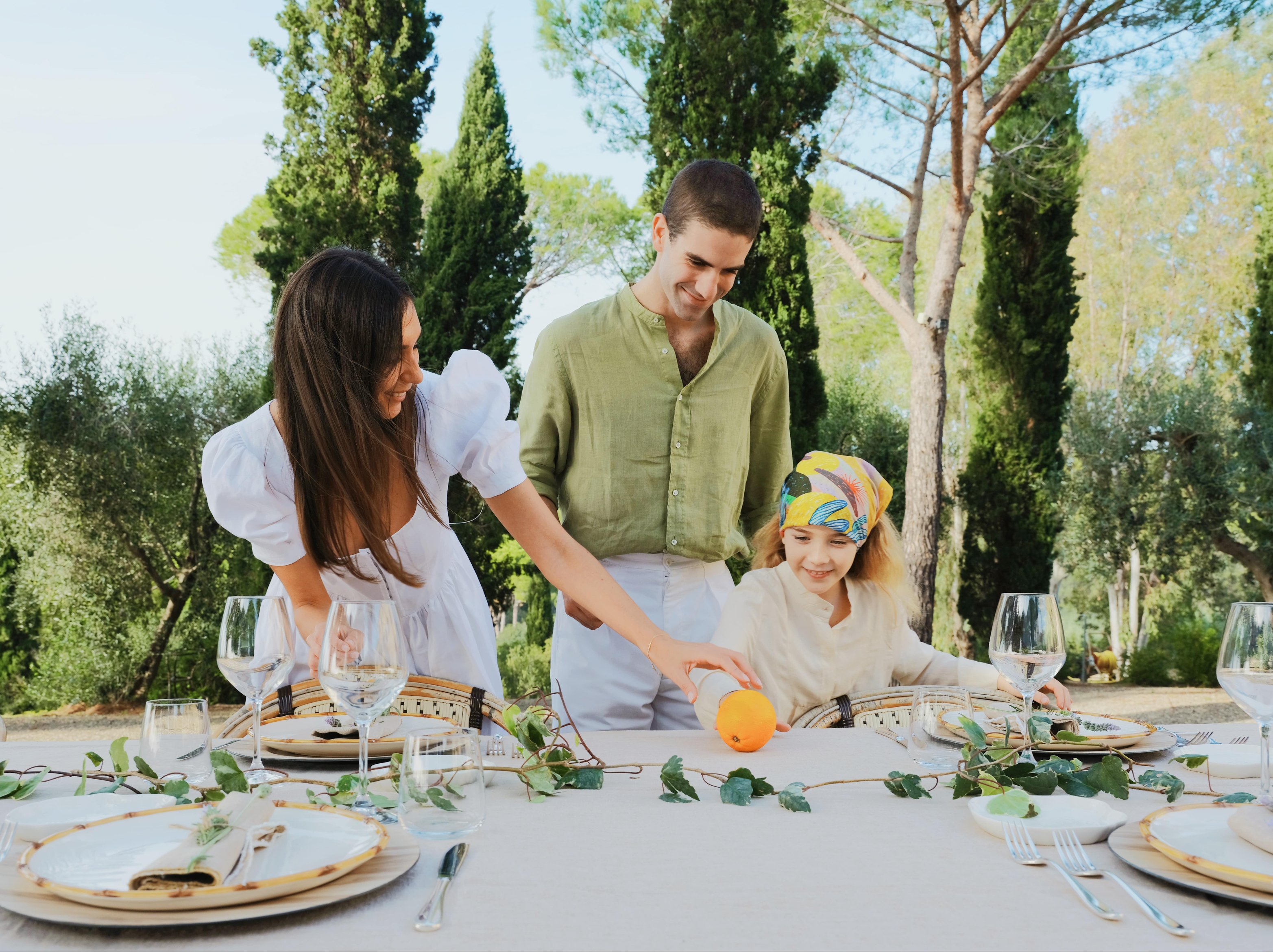 family preparing for an al fresco meal
