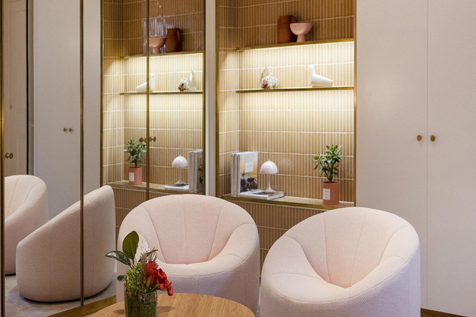 A private shopping salon with armchairs and display shelves in a Paris department store
