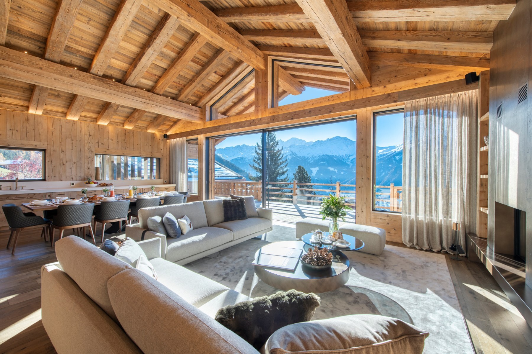 The living room at Chalet Foulon, with large windows facing the Verbier valley