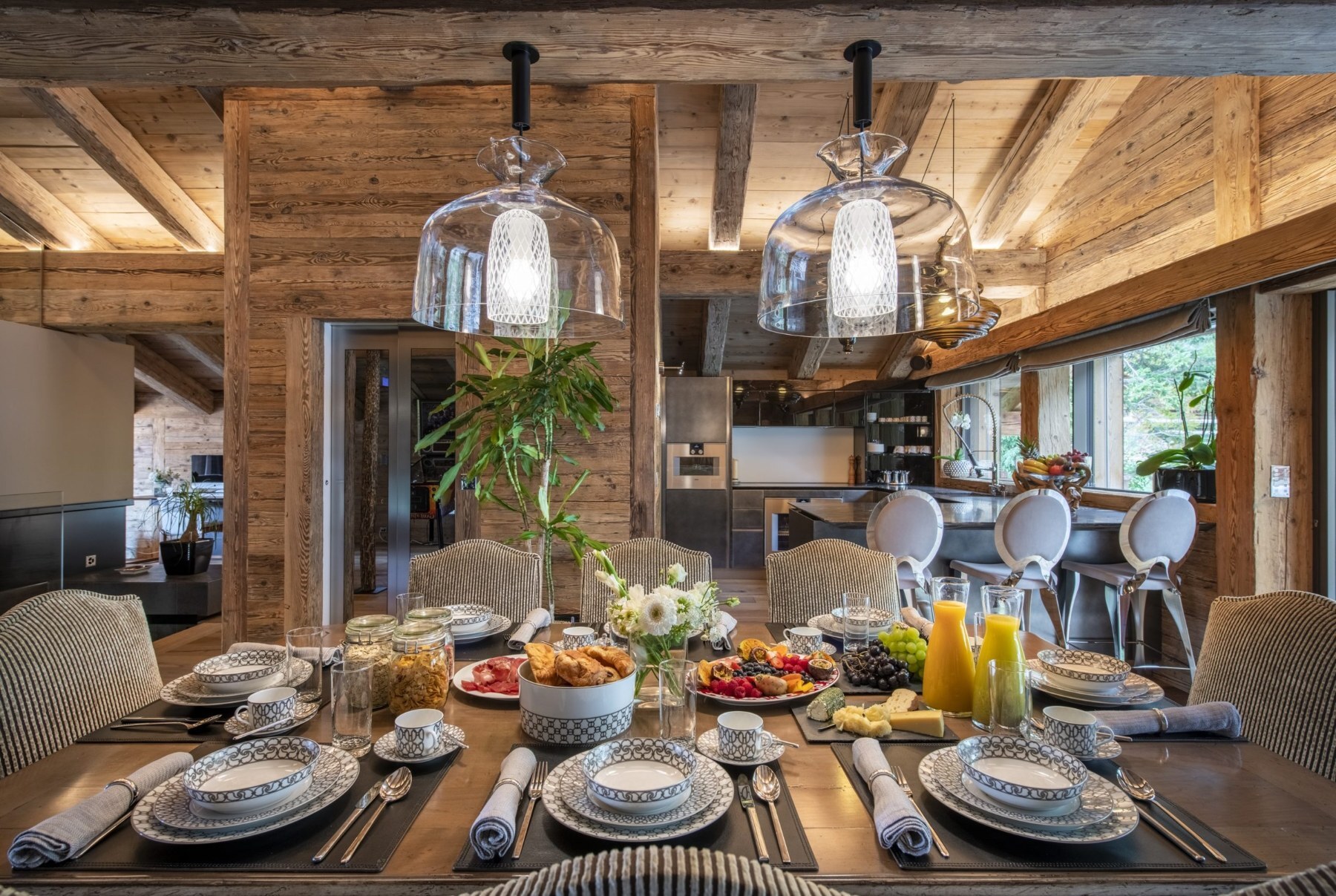 Breakfast laid out on the dining table at Chalet Marmottière in Verbier